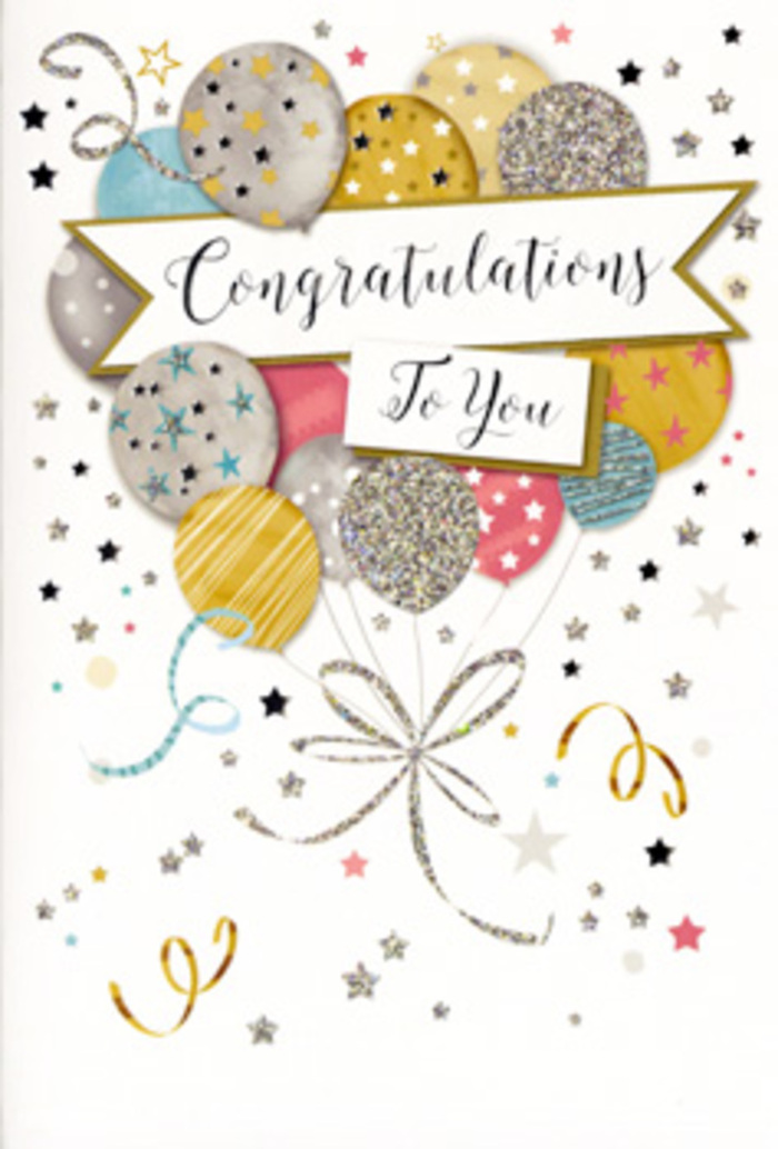 The photograph captures a refined congratulations card standing upright, its design evoking the feeling of a well-planned celebration in one of Mill Hill's cosy homes. The central focus is a sweeping cream-coloured banner that arches across the card, carrying the words Congratulations To You in elegant, curling script reminiscent of fine stationery. Behind and above this banner rises a lush bouquet of illustrated balloons in harmonious shades of muted gold, soft silver, champagne beige, sky blue, blush pink and cool grey. Each balloon is rendered with subtle shading to suggest roundness and gentle illumination, and is adorned with decorative patterns-glitter-style stripes, star clusters and scattering dots-that lend a sense of sparkle without overwhelming the eye. From the base of the balloons fall thin, twisting ribbons in metallic gold and silver tones, meeting near the lower edge in a playful knot, like ribbons a florist might carefully tie around a bouquet before a local delivery. The background is a pale, almost pearly tone, scattered with tiny metallic stars and swirling confetti curls that float around the balloons, echoing the joy of a surprise party near Mill Hill Broadway after exam results or a big promotion. The overall atmosphere is bright yet sophisticated, creating an impression of heartfelt congratulations wrapped in glamour, the visual equivalent of a warm, proud hug paired with fresh flowers.